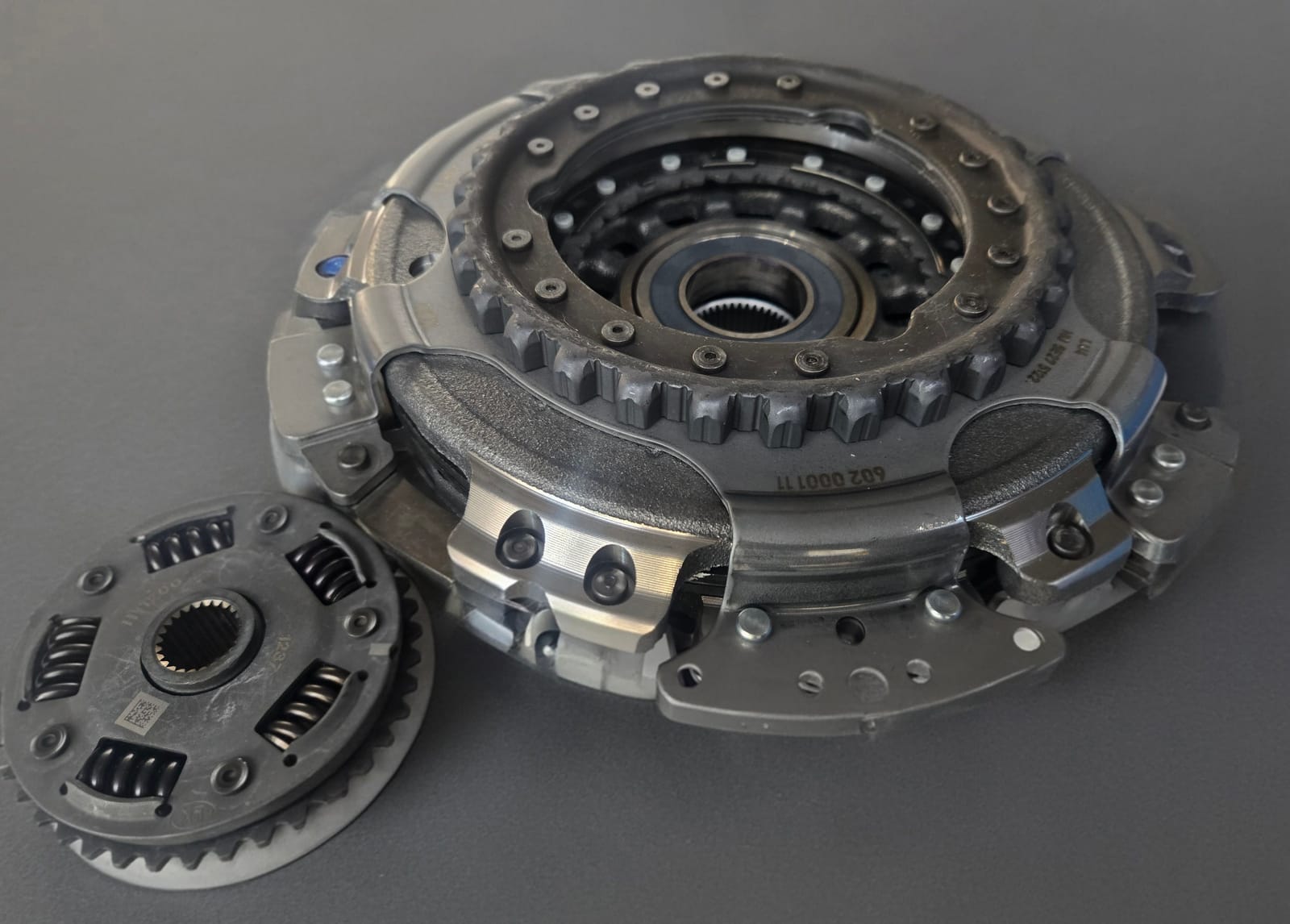 Modern dual-clutch pack and torsional damper from an automatic transmission on the workbench